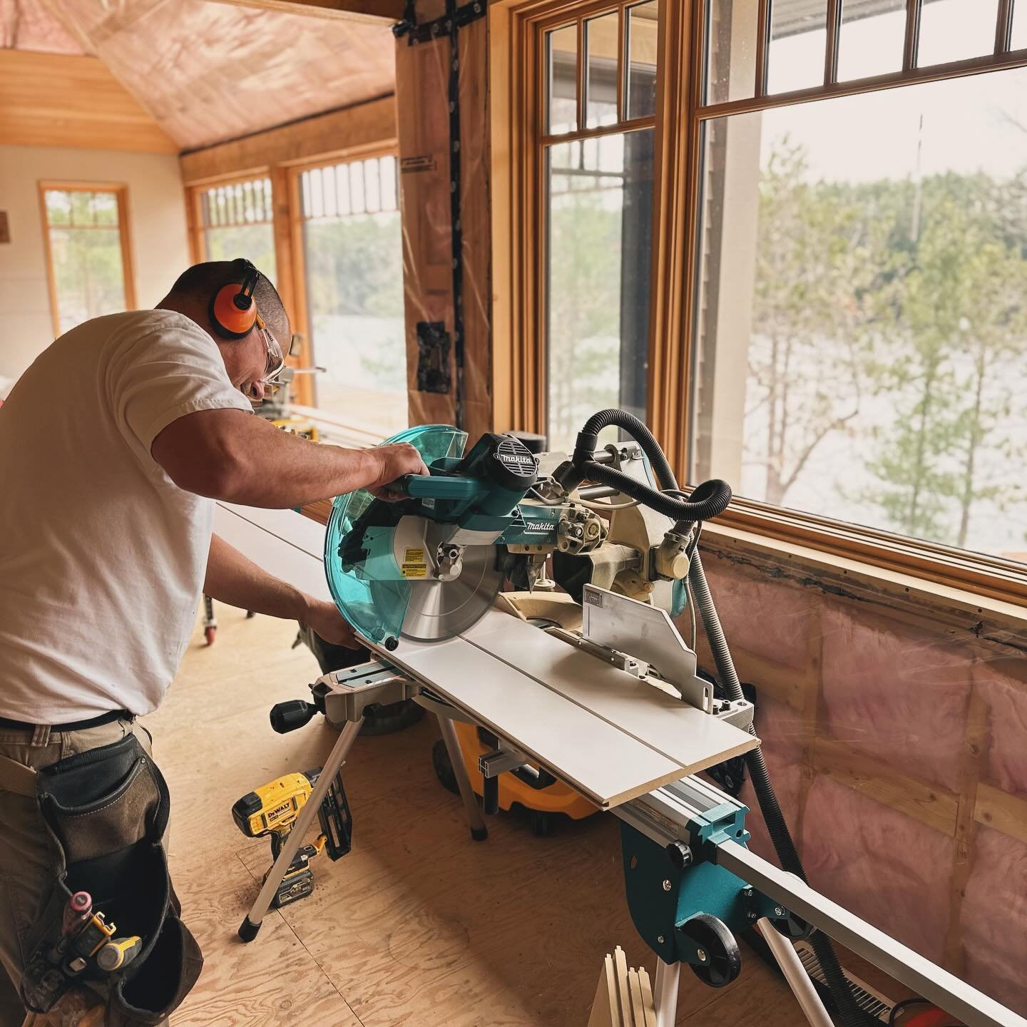 Sturgeon craftsman carefully working on interior wood finishes